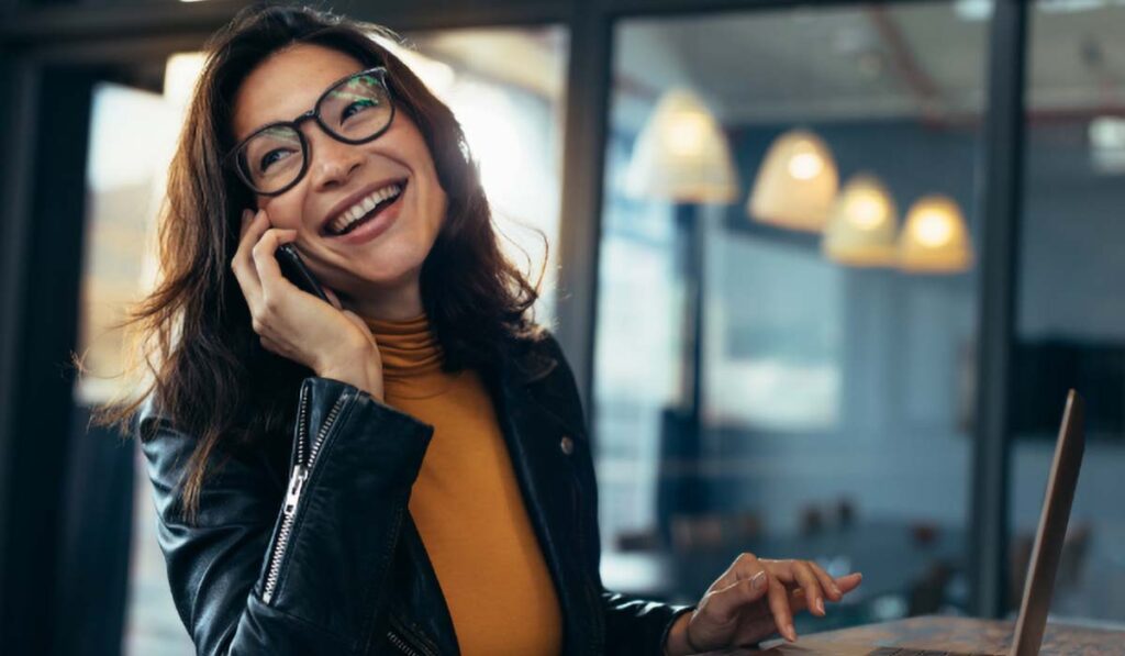smiling woman on phone