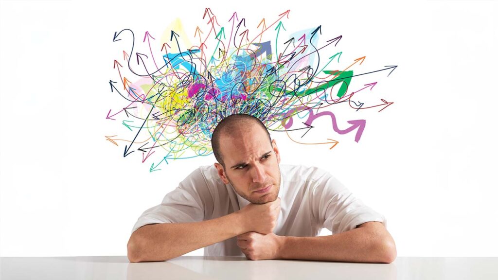 Confused man with tangle of colored arrows around his head
