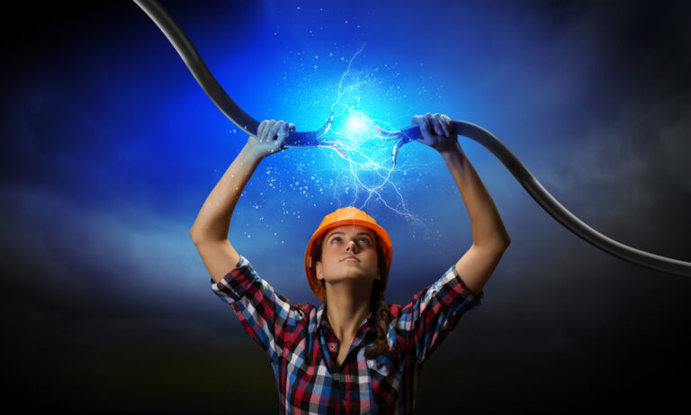 Woman holding ends of broken electrical cable, with sparks between