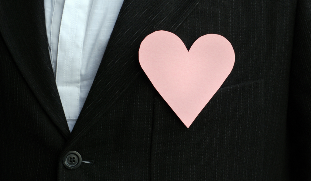 Pink paper heart affixed to person