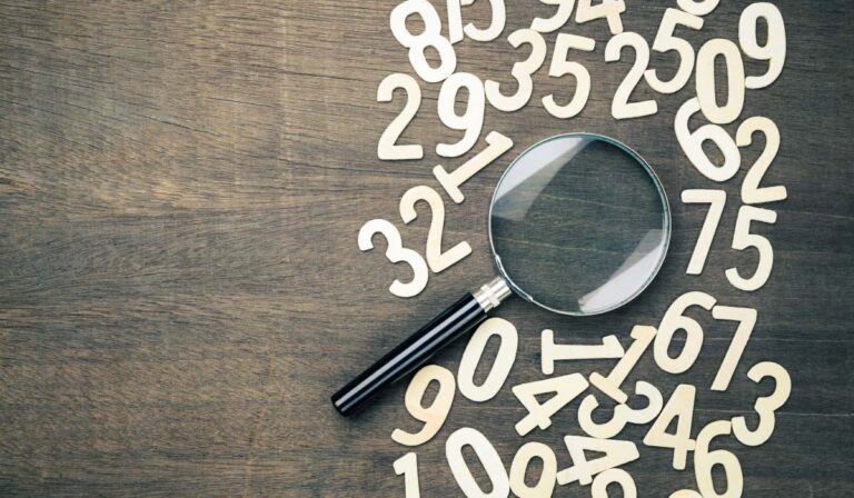 Magnifying glass with scattered numbers