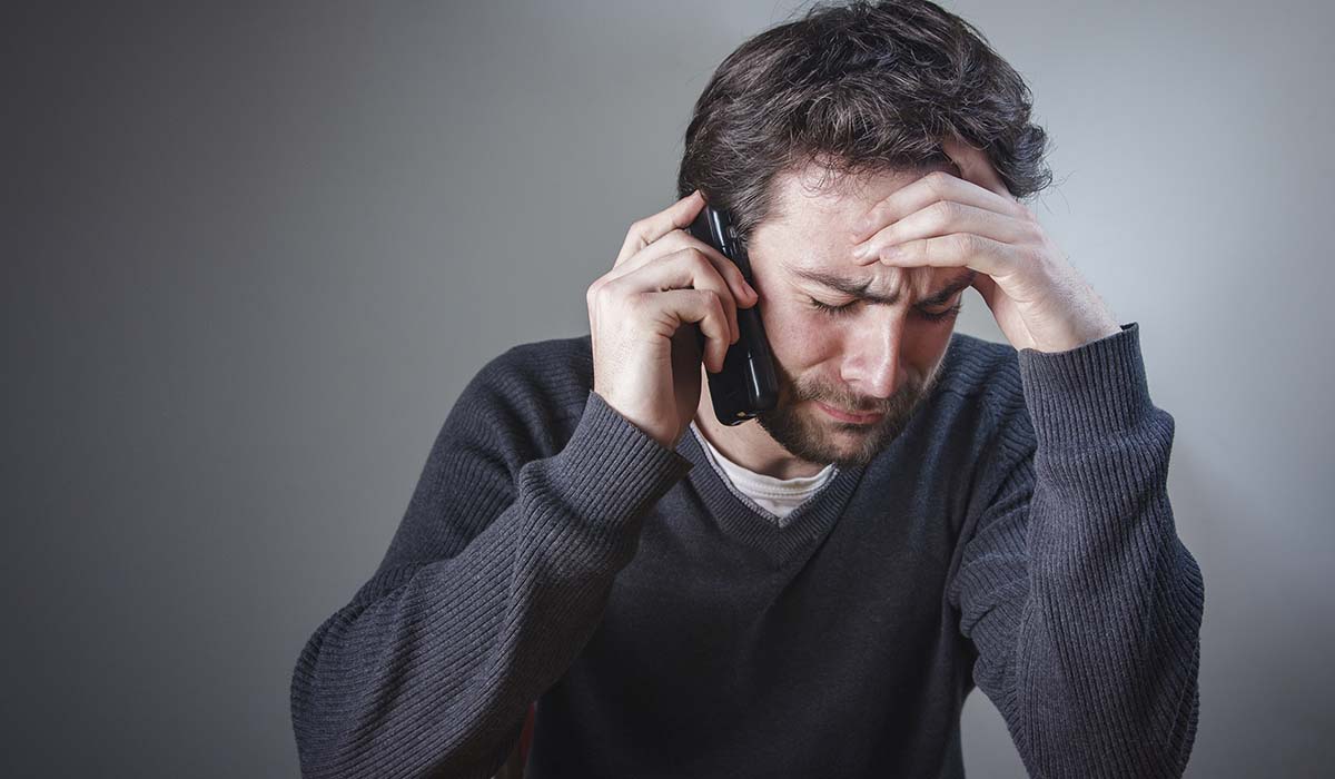 unhappy man on phone