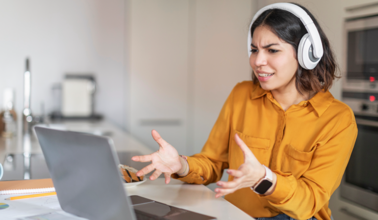 Woman looking confused at her computer